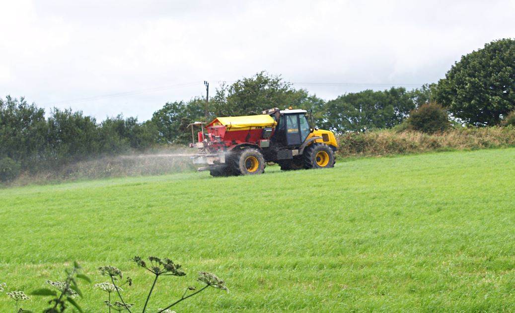 Tractor spreading fertiliser